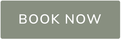 Green-gray rounded button with the text 'BOOK NOW' indicating a call to action